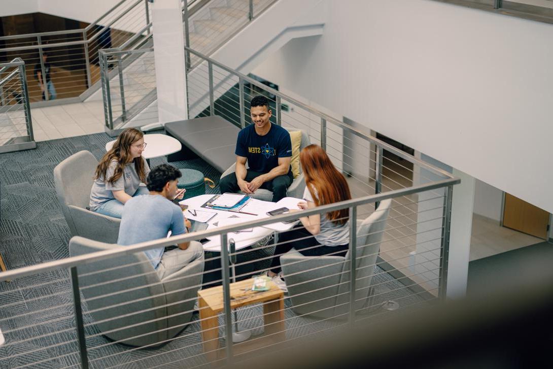 students studying above coffee shop in Learning Commons